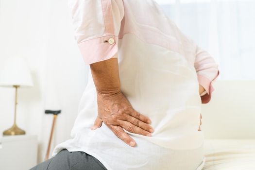 Back pain of old woman at home, healthcare problem of senior concept