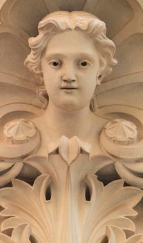 Novelda, Alicante, Spain- September 18, 2021: Carved stone woman face on the facade of the Modernist House Museum in Novelda