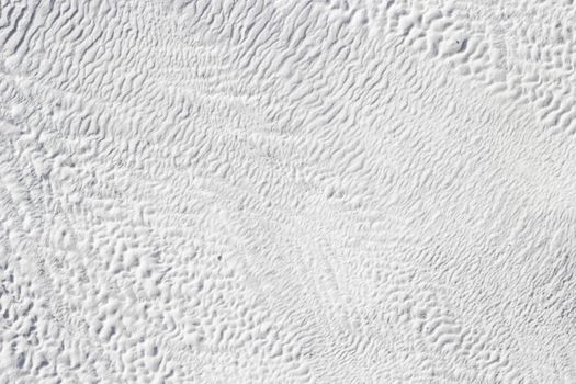 White texture of abstract background of Pamukkale calcium travertine in Turkey.