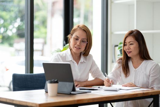 Businessman and partner hand using digital tablet and making presentation business strategy.