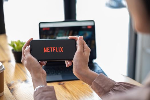 CHIANG MAI, THAILAND OCT 01, 2021 : Netflix logo on iPhone XS screen. Netflix is an international leading subscription service for watching TV episodes and movies