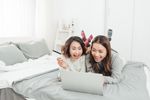  Beautiful female friendship enjoy weekend activity lifestyle with technology at home.