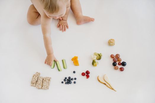 high angle baby choosing what eat alone. Resolution and high quality beautiful photo