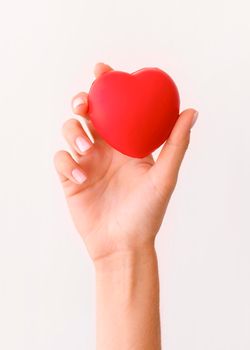 front view hand holding heart shape. High resolution photo