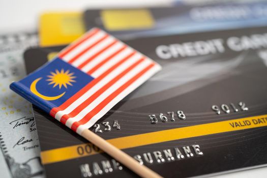 Malaysia flag on credit card. Finance development, Banking Account, Statistics, Investment Analytic research data economy, Stock exchange trading, Business company concept.