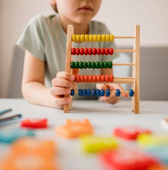 child learning use abacus home. High resolution photo