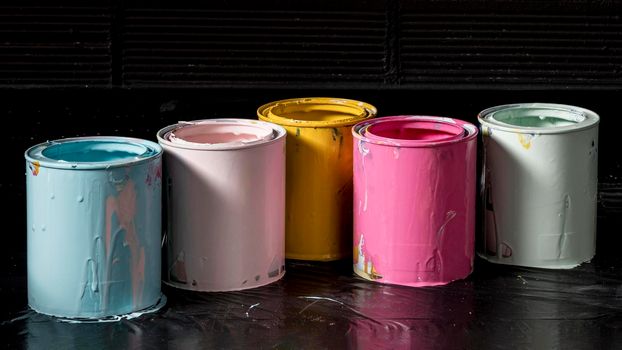 high angle colored paint cans. Beautiful photo