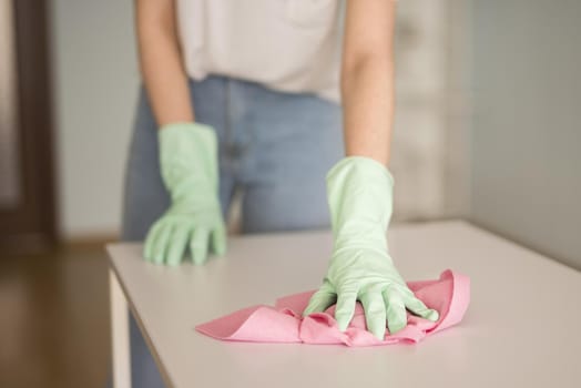 front view defocused woman cleaning surface. Resolution and high quality beautiful photo