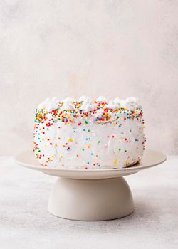 delicious birthday cake with sprinkles. High resolution photo