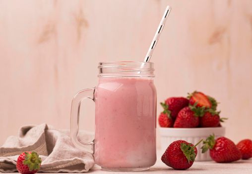 front view strawberry milkshake with straw. Beautiful photo