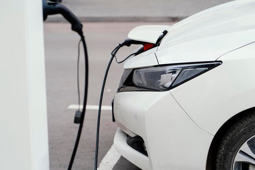 side view automobile being charged electric vehicle charging station. Beautiful photo
