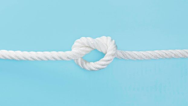 white solid rope with knot. High resolution photo