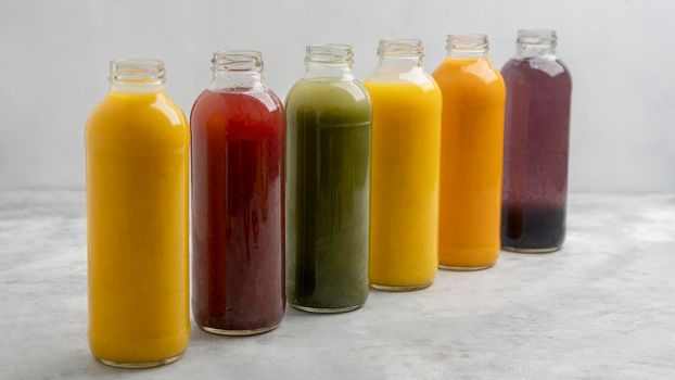 healthy juice bottles assortment. High resolution photo