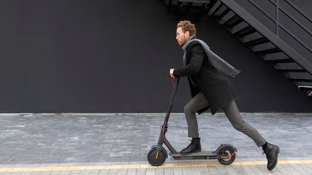 handsome male riding electric scooter. Beautiful photo