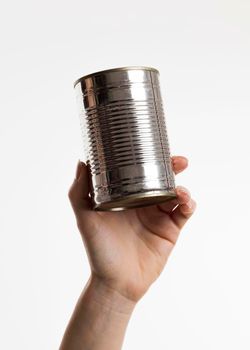 hand holding tin can. Beautiful photo