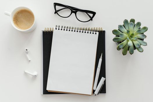 arrangement with empty notepad desk. Beautiful photo