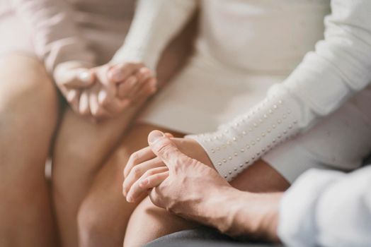 parents daughter praying together close up. High resolution photo