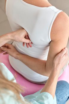 physiotherapist undergoing therapy with female patient. High resolution photo