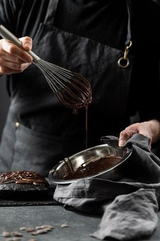 pastry chef preparing chocolate cake. High resolution photo