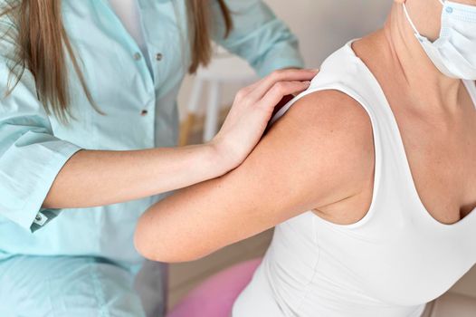 physiotherapist undergoing therapy with female patient. Beautiful photo