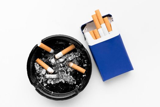 ashtray pack cigarettes. High resolution photo