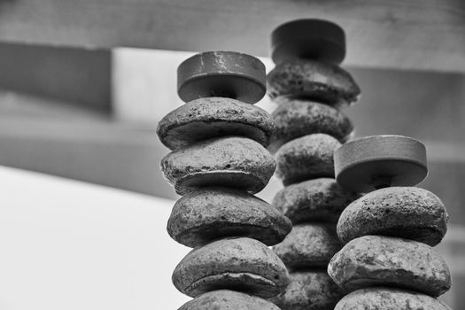 Image of Black and white of candle sticks from round stones