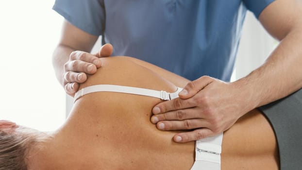 front view osteopathic therapist checking female patient s back 2. Resolution and high quality beautiful photo