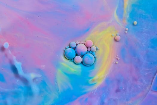 Image of Colorful floating orbs on mystical unicorn colored smooth surface