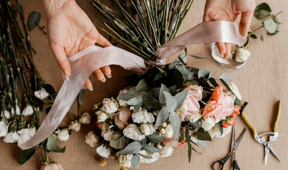 woman making beautiful floral bouquet. High resolution photo