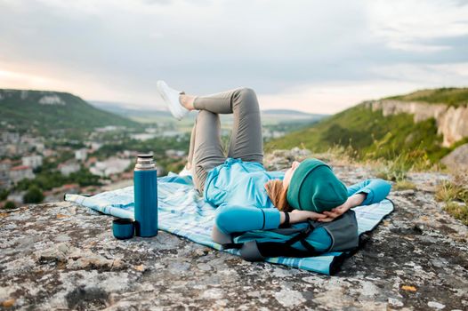 traveller with beanie relaxing outdoors. Beautiful photo