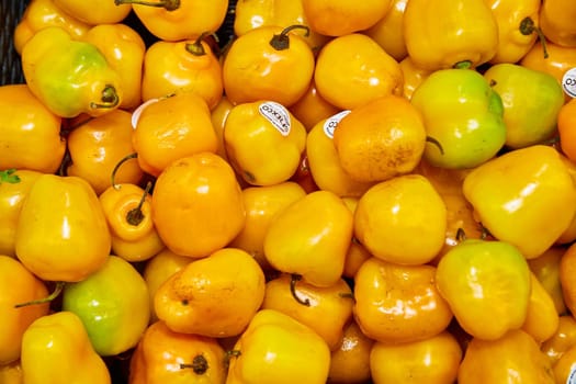 Image of Tray full of colorful yellow peppers