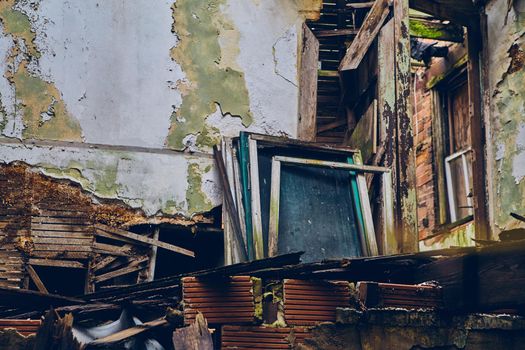 Image of Abandoned building with collapsed floors and old wood frames