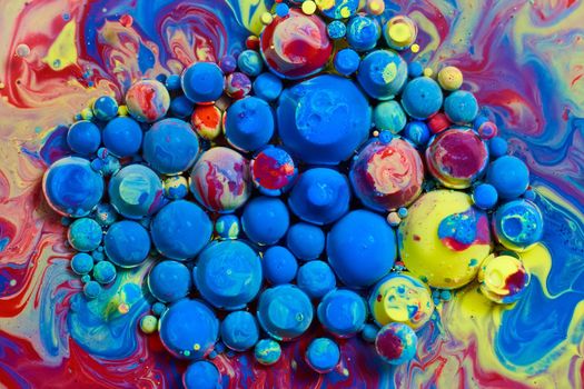 Image of Colorful range of rainbow balls floating on surface