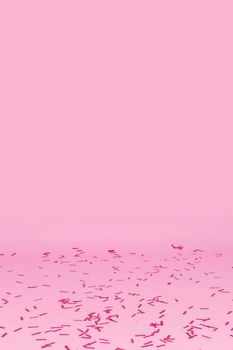 confetti scattered pink background. Beautiful photo