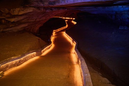 Image of Lite pathway through dark and deep cave