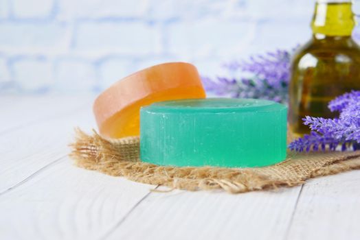 Homemade soap with dried lavender on table