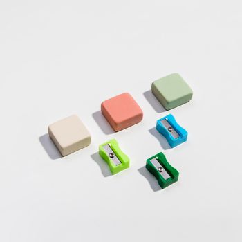 colourful sharpeners erasers high view. High resolution photo