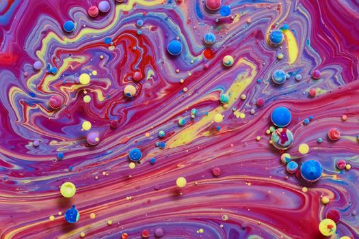 Image of Mixing milk, paint, and oil to create mystical rainbow colors and orbs