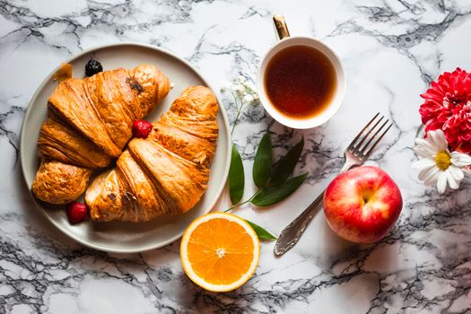 flat lay croissants with fruits. High resolution photo