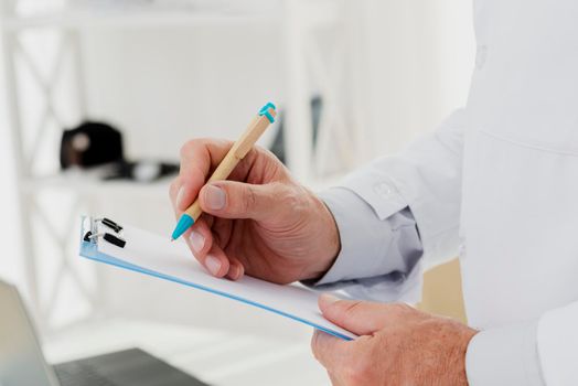 close up doctor writing clipboard. High resolution photo