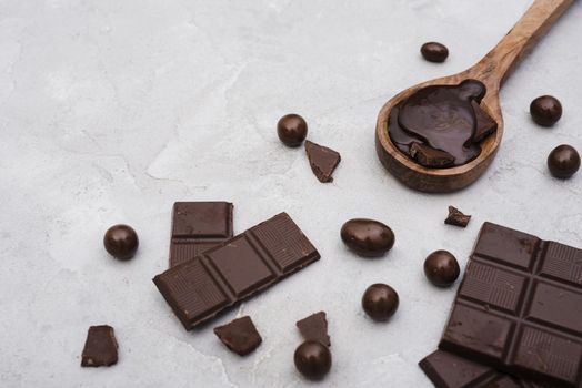 high angle chocolate bars wooden spoon with chocolate syrup 2. Resolution and high quality beautiful photo