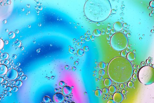 Oil drops in water. Defocused abstract psychedelic pattern image. Abstract background with colorful gradient colors. DOF