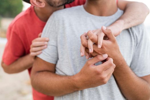 close up men holding hands. High resolution photo
