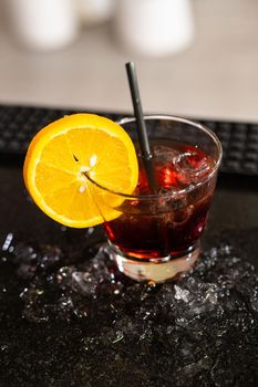 composition of various cocktails on the counter in strong colors and fruit on the head