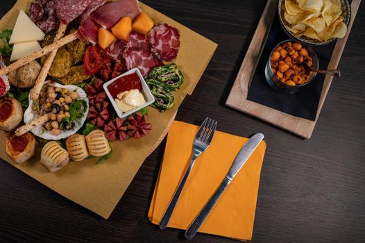 composition of mixed appetizer with coktail on a cutting board