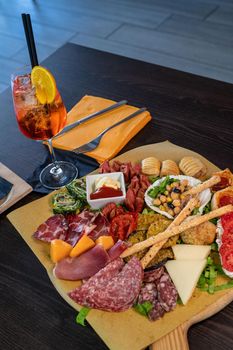 composition of mixed appetizer with coktail on a cutting board