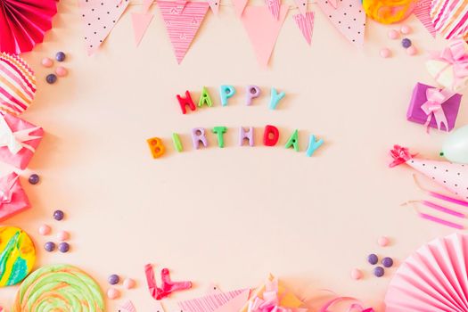 happy birthday text with party concept colored background. High resolution photo