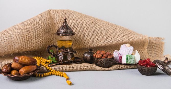 turkish delight with tea glass dates fruit. High resolution photo