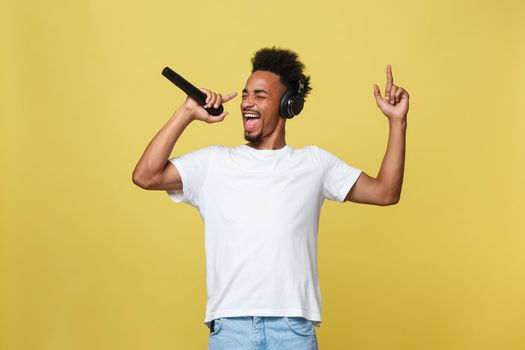 young handsome african american boy singing opera emotional with microphone