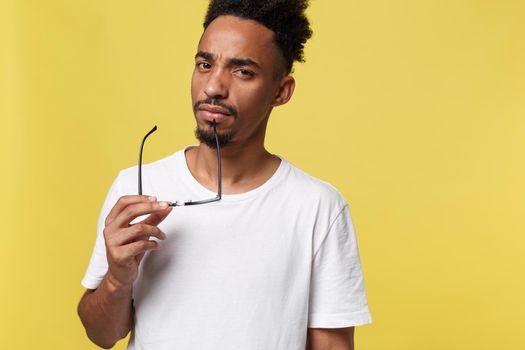 African american business man holding a glass, isolated on yellow background - Black people.